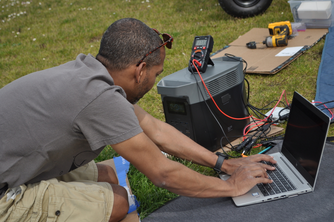 Jose at the data station, EcoFlow and multimeter